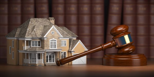 house-with-gavel-and-law-books-real-estate-law-XM3QZCA-min